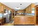 Well-equipped kitchen with oak cabinets, stainless appliances, and tile countertops at 1505 Ozora Rd, Loganville, GA 30052
