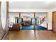 Open-concept living room with classic fireplace, plush blue carpet, and generous natural light at 1505 Ozora Rd, Loganville, GA 30052