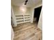 Finished basement featuring built-in bookshelves and a paneled wainscoting detail at 3585 Shepherds Ln, Loganville, GA 30052