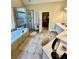Bright and airy bathroom with double vanity, soaking tub, and step-in shower at 3585 Shepherds Ln, Loganville, GA 30052