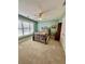 Comfortable bedroom with soft carpeting and a large window at 3585 Shepherds Ln, Loganville, GA 30052
