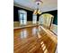 Elegant dining room with hardwood floors, chandelier, and ample natural light at 3585 Shepherds Ln, Loganville, GA 30052