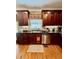 Gourmet kitchen with stainless steel dishwasher and granite countertops with tile backsplash at 3585 Shepherds Ln, Loganville, GA 30052