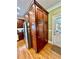 Spacious kitchen pantry with stainless steel refrigerator and hardwood flooring at 3585 Shepherds Ln, Loganville, GA 30052