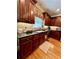 Traditional kitchen with wooden cabinets, granite countertops, and stainless steel appliances at 3585 Shepherds Ln, Loganville, GA 30052