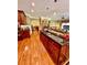Open concept kitchen with large center island and access to the living room at 3585 Shepherds Ln, Loganville, GA 30052