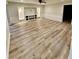 Bright living room features luxury vinyl plank flooring and a built-in entertainment center at 3585 Shepherds Ln, Loganville, GA 30052