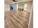 Bright living room features luxury vinyl plank flooring and a built-in entertainment center at 3585 Shepherds Ln, Loganville, GA 30052