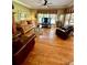 Cozy living room with hardwood floors, comfortable seating, and a ceiling fan at 3585 Shepherds Ln, Loganville, GA 30052