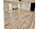 Bright living room features luxury vinyl plank flooring and a built-in entertainment center at 3585 Shepherds Ln, Loganville, GA 30052