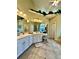 Bright primary bathroom with dual vanities, tile flooring, and a makeup table at 3585 Shepherds Ln, Loganville, GA 30052
