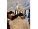 Spacious primary bedroom featuring tray ceilings, a ceiling fan, and large windows at 3585 Shepherds Ln, Loganville, GA 30052