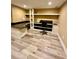 Home office featuring modern vinyl flooring, built-in desk, and good lighting at 3585 Shepherds Ln, Loganville, GA 30052
