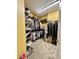 Walk-in closet with built-in shelving and storage space at 3585 Shepherds Ln, Loganville, GA 30052