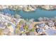 Aerial view of home showcasing lakefront lot, mature trees, and neighborhood at 10815 Donamere Dr, Johns Creek, GA 30022