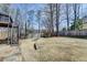 Spacious backyard with a stone patio, playset, and plenty of room for outdoor activities at 10815 Donamere Dr, Johns Creek, GA 30022
