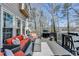 Outdoor deck features a lake view, comfortable seating, and grill, perfect for relaxation at 10815 Donamere Dr, Johns Creek, GA 30022