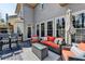Outdoor deck with comfortable seating, a table, and an umbrella for relaxation at 10815 Donamere Dr, Johns Creek, GA 30022