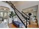 Elegant entryway with staircase, hardwood floors, and decorative accents at 10815 Donamere Dr, Johns Creek, GA 30022