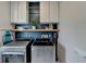 Functional laundry room with shelving, cabinets, and modern washer and dryer at 10815 Donamere Dr, Johns Creek, GA 30022
