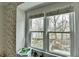 Large bedroom window offering wooded views of the lake and backyard playground at 10815 Donamere Dr, Johns Creek, GA 30022