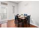 Cozy dining area featuring a wooden table set for four, with access to the exterior at 209 Townview Dr, Woodstock, GA 30189