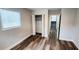 Bedroom with fresh paint, wood-look laminate floors, closet, and a bright sunny window at 2653 Williamsburg Dr, Decatur, GA 30034