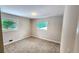 Clean bedroom offering neutral colors, plush carpeting, and natural light at 2653 Williamsburg Dr, Decatur, GA 30034