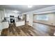 Bright kitchen with white cabinets, stainless steel appliances, and island with granite countertops at 2653 Williamsburg Dr, Decatur, GA 30034