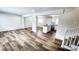 Bright living room open to kitchen and stairs, boasting new floors at 2653 Williamsburg Dr, Decatur, GA 30034