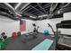 Workout room with black rubber floor, weight rack, treadmill, and an American flag at 2805 Roxburgh Dr, Roswell, GA 30076