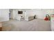Spacious basement featuring neutral carpeting and a large-screen television at 2805 Roxburgh Dr, Roswell, GA 30076