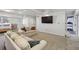 A finished basement offers a TV, seating, and a view to the backyard at 2805 Roxburgh Dr, Roswell, GA 30076