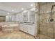 This bathroom features tile flooring, a tiled glass shower, double sinks, and a jetted tub at 2805 Roxburgh Dr, Roswell, GA 30076