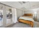 Carpeted bedroom with walkout patio doors and a warm, inviting atmosphere at 2805 Roxburgh Dr, Roswell, GA 30076