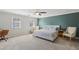 Bedroom features light neutral paint with accent wall, carpet, ceiling fan, and natural light at 2805 Roxburgh Dr, Roswell, GA 30076