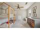 This bedroom features a bunk bed, built-in shelves, and a large window for natural light at 2805 Roxburgh Dr, Roswell, GA 30076