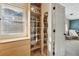 A bright closet features a shelf for shoes, drawers for storage, and a window for natural light at 2805 Roxburgh Dr, Roswell, GA 30076