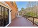 Spacious deck with iron railing and a view of the wooded backyard at 2805 Roxburgh Dr, Roswell, GA 30076