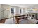 Charming dining room featuring hardwood floors, large windows, and modern lighting fixtures at 2805 Roxburgh Dr, Roswell, GA 30076