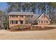Beautiful brick home with a landscaped front yard and classic architectural details at 2805 Roxburgh Dr, Roswell, GA 30076