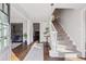 Inviting foyer with hardwood floors, elegant staircase, and plenty of natural light at 2805 Roxburgh Dr, Roswell, GA 30076