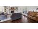 Cozy living space with a fireplace, built-in shelving, and views of the outdoors at 2805 Roxburgh Dr, Roswell, GA 30076