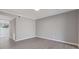 Spacious bedroom features light gray walls, trim work, recessed lighting, and wood-look flooring at 3236 Henderson Mill Rd, Atlanta, GA 30341