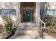 Inviting front entrance with a beautiful arched entry, staircase, and an appealing green door at 3236 Henderson Mill Rd, Atlanta, GA 30341