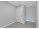 Neutral foyer featuring wood-look floors, white trim, and a door leading to the outside at 3236 Henderson Mill Rd, Atlanta, GA 30341