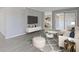 Stylish living room with modern furnishings, a decorative rug, and sliding glass doors to a balcony at 3236 Henderson Mill Rd, Atlanta, GA 30341