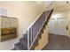 Stairwell with beige carpet, white handrails, and doors to units numbered 5 and 6 at 3236 Henderson Mill Rd, Atlanta, GA 30341