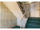 Interior stairwell with green carpet and bamboo wallpaper near doors numbered 5 at 3236 Henderson Mill Rd, Atlanta, GA 30341