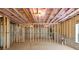 Unfinished basement featuring exposed beams and framing, concrete flooring, and utility connections at 3255 Hilltop Cir, Marietta, GA 30066